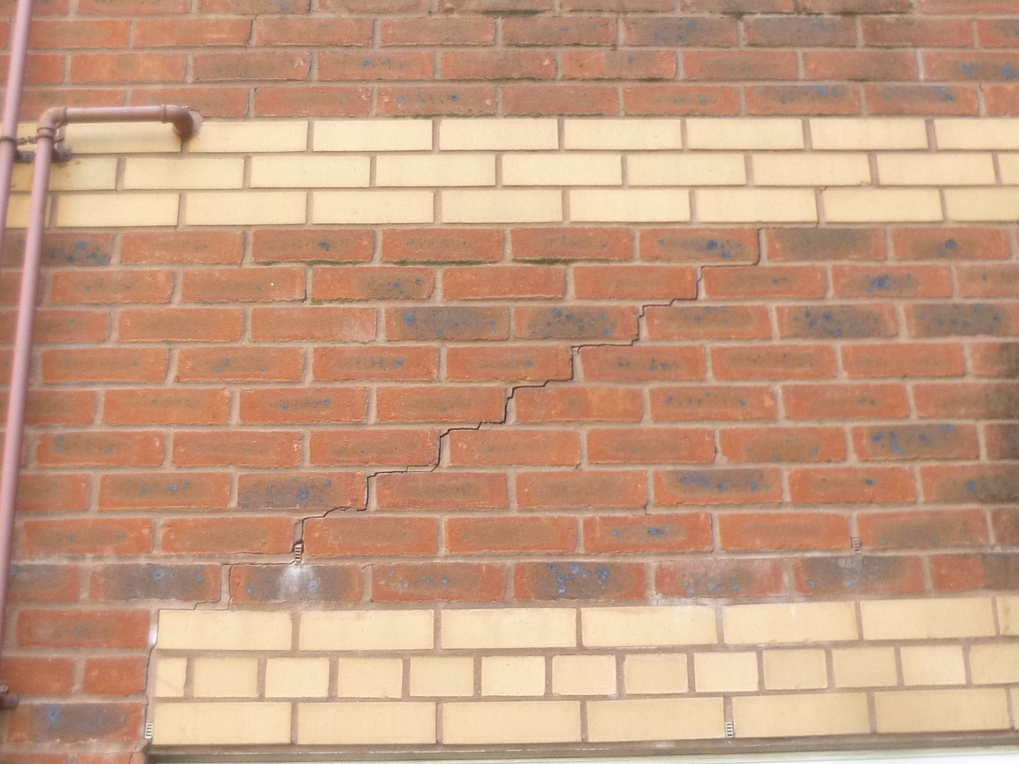 Diagonal Stepped Cracking to Residential Apartment Block - Helifix Helibars later used for repairs.